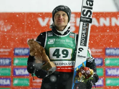 Ski Jumping - Ski Jumping World Cup - Zakopane, Poland - January 11, 2026 Slovenia's Anze Lanisek poses with the trophy after winning the Men's Individual HS140 REUTERS/Kacper Pempel