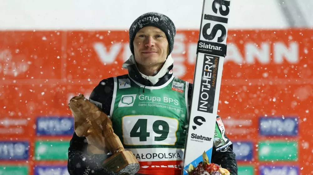 Ski Jumping - Ski Jumping World Cup - Zakopane, Poland - January 11, 2026 Slovenia's Anze Lanisek poses with the trophy after winning the Men's Individual HS140 REUTERS/Kacper Pempel