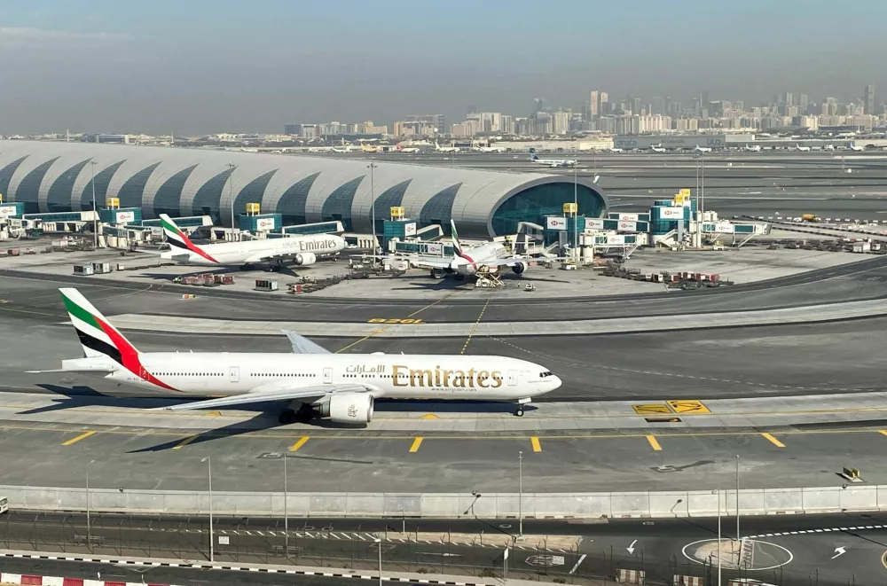 FILE PHOTO: Emirates airliners are seen on the tarmac in a general view of Dubai International Airport in Dubai, United Arab Emirates January 13, 2021. Picture taken through a window. REUTERS/Abdel Hadi Ramahi//File Photo