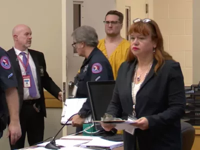 This image taken from video shows Michael David McKee walking into the courtroom on Monday, January 12, 2026, in Rockford, Ill. (WIFR News/Pool Photo via AP)
