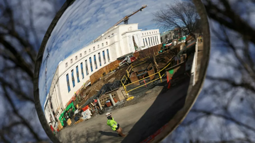 A mirror reflects the construction site of the Federal Reserve headquarters, after U.S. President Donald Trump renewed his threat to bring a lawsuit against&nbsp;Federal Reserve Chair Jerome Powell over Powell's management of renovations of the building, in Washington, D.C., U.S., January 12, 2026. REUTERS/Kevin Lamarque   TPX IMAGES OF THE DAY