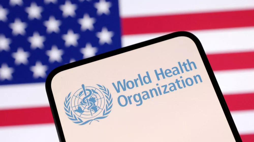 FILE PHOTO: World Health Organization (WHO) logo and U.S. flag are seen in this illustration taken April 23, 2025. REUTERS/Dado Ruvic/Illustration/File Photo