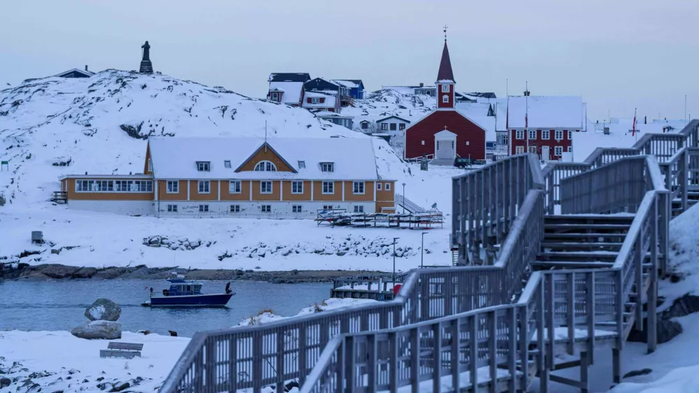 A boat travels at the sea inlet in Nuuk, Greenland, on Tuesday, Jan. 13, 2026. (AP Photo/Evgeniy Maloletka)