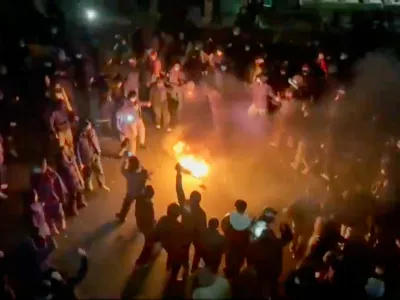FILE - This frame grab from footage circulating on social media shows protesters dancing and cheering around a bonfire as they take to the streets despite an intensifying crackdown as the Islamic Republic remains cut off from the rest of the world, in Tehran, Iran, Jan. 9, 2026. (UGC via AP, File)