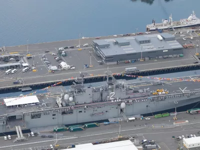 FILE -In this aerial photo taken Aug. 2, 2014, the U.S. Navy USS Essex is shown docked near downtown Seattle during the annual Seafair summer festival. (AP Photo/Ted S. Warren, File)
