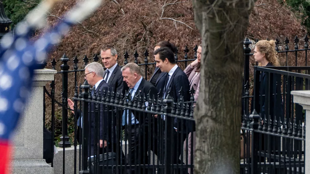 Denmark's Foreign Minister Lars L&oslash;kke Rasmussen, third from left, Greenland's Foreign Minister Vivian Motzfeldt, not shown, and their delegations leave the Old Eisenhower Executive Office Building on the grounds of the White House, Wednesday, Jan. 14, 2026, in Washington. (AP Photo/Alex Brandon)