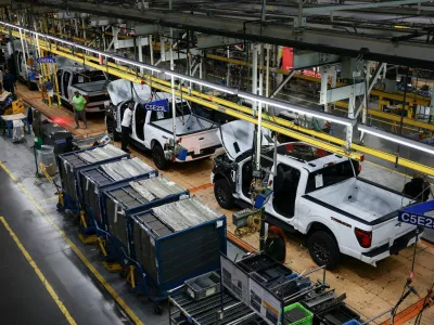 Employees work at the Ford production center, on the day of a visit by U.S. President Donald Trump, in Dearborn, Michigan, U.S., January 13, 2026. REUTERS/Evelyn Hockstein