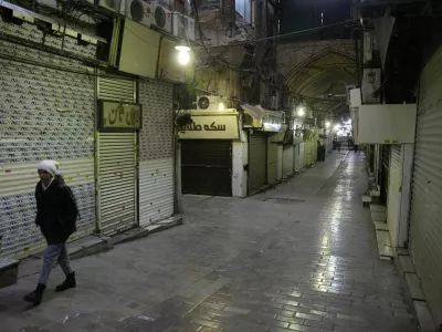 People walk past closed shops, following protests over a plunge in the currency's value, in the Tehran Grand Bazaar in Tehran, Iran, January 15, 2026. Majid Asgaripour/WANA (West Asia News Agency) via REUTERS ATTENTION EDITORS - THIS PICTURE WAS PROVIDED BY A THIRD PARTY
