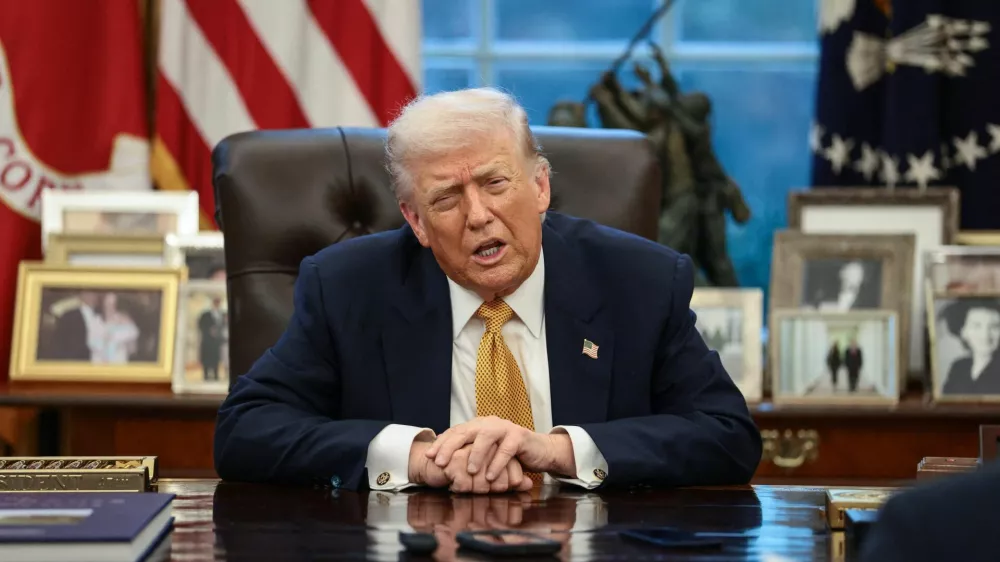 U.S. President Donald Trump is interviewed by Reuters White House correspondent Steve Holland (not pictured) during an exclusive interview in the Oval Office in the White House in Washington, D.C., U.S., January 14, 2026. REUTERS/Evelyn Hockstein