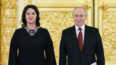 Russian President Vladimir Putin, right, and Slovenian Ambassador to Russia, Alenka Suhadolnik, attend a ceremony to receive credentials from newly arrived ambassadors at the Alexander Hall of the Grand Kremlin Palace in Moscow, Russia, Thursday, Jan. 15, 2026. (Alexander Kazakov, Sputnik, Kremlin Pool Photo via AP)