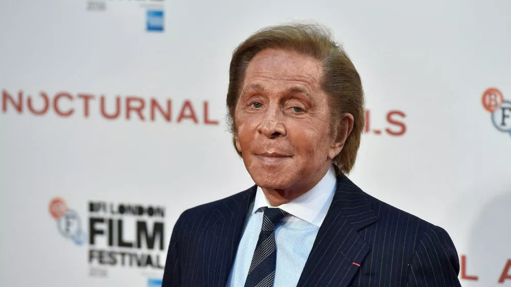 FILE PHOTO: Designer Valentino Garavani poses as he arrives for the gala screening of the film "Nocturnal Animals" during the 60th British Film Institute (BFI) London Film Festival at Leicester Square in London, Britain October 14, 2016. REUTERS/Hannah McKay/File Photo