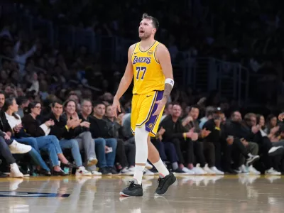 Jan 15, 2026; Los Angeles, California, USA; Los Angeles Lakers guard Luka Doncic (77) reacts against the Charlotte Hornets in the second half at Crypto.com Arena. Mandatory Credit: Kirby Lee-Imagn Images