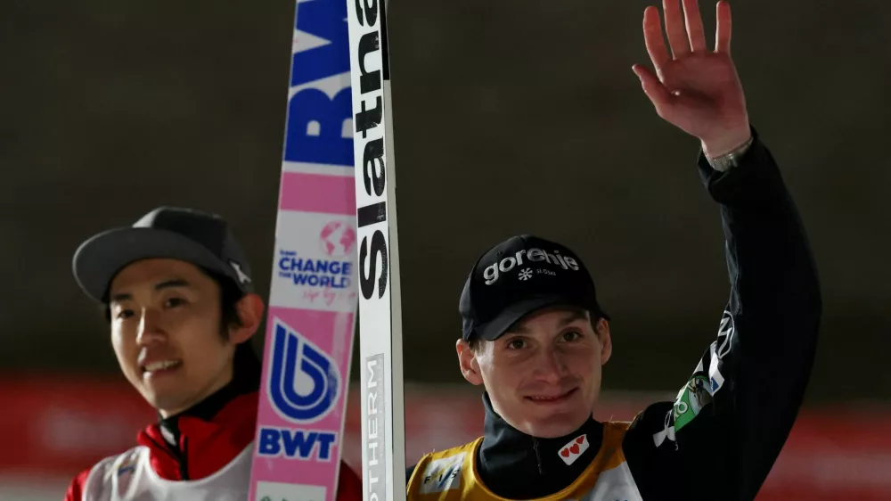 Ski Jumping - Ski Jumping World Cup - Sapporo, Japan - January 17, 2026 Slovenia's Domen Prevc celebrates after winning the men's large hill along with second placed Japan's Naoki Nakamura REUTERS/Issei Kato