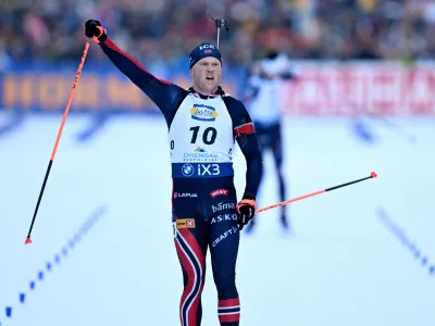 Norway's Johannes Dale-Skjevdal celebrates winning a Biathlon, men's World Cup, 12.5k pursuit race, in Ruhpolding, Germany, Sunday, Jan. 18, 2026. (Sven Hoppe/dpa via AP)
