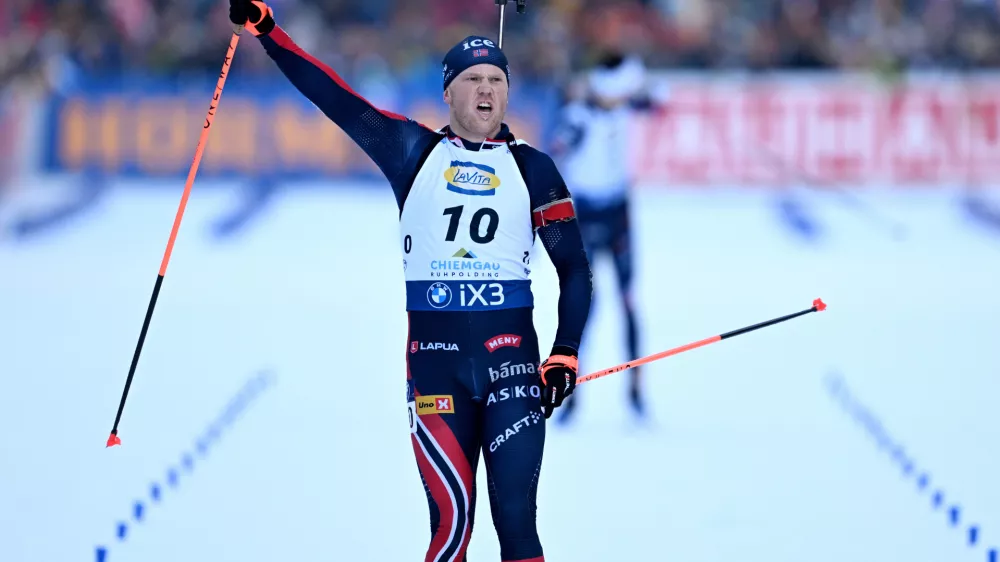 Norway's Johannes Dale-Skjevdal celebrates winning a Biathlon, men's World Cup, 12.5k pursuit race, in Ruhpolding, Germany, Sunday, Jan. 18, 2026. (Sven Hoppe/dpa via AP)