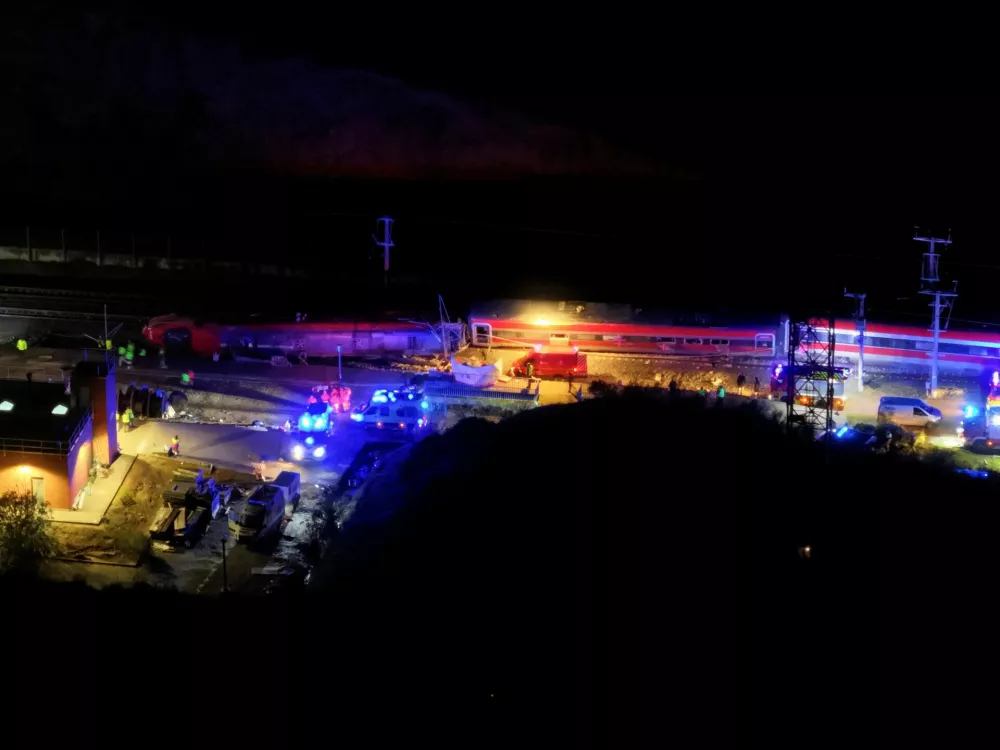 A drone view shows emergency services at work at the site of a deadly train derailment, after a high-speed train derailed and collided with another oncoming train near Adamuz, in Cordoba province, Spain, January 19, 2026. REUTERS/Leonardo Benassatto   TPX IMAGES OF THE DAY