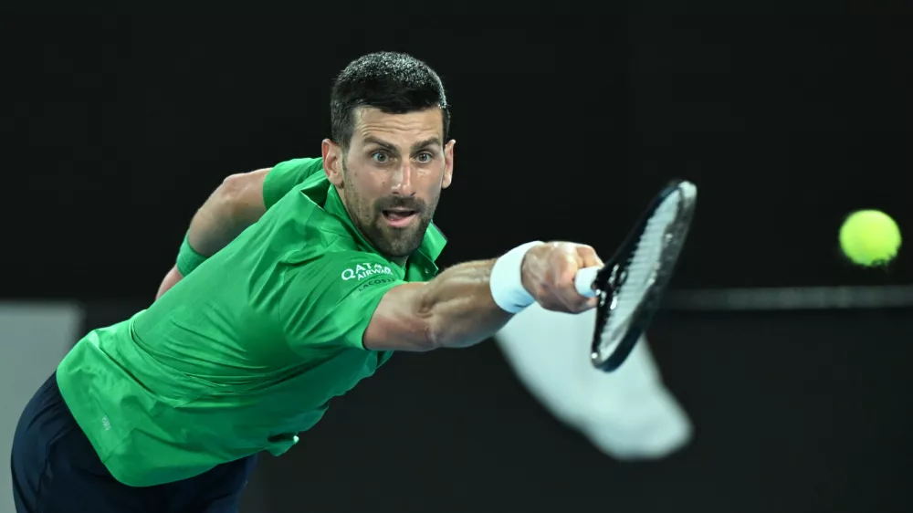 19 January 2026, Australia, Melbourne: Novak Djokovic of Serbia in action during the Men's 1st round match against Pedro Martinez of Spain on day 2 of the 2026 Australian Open tennis tournament at Melbourne Park in Melbourne. Photo: James Ross/AAP/dpa