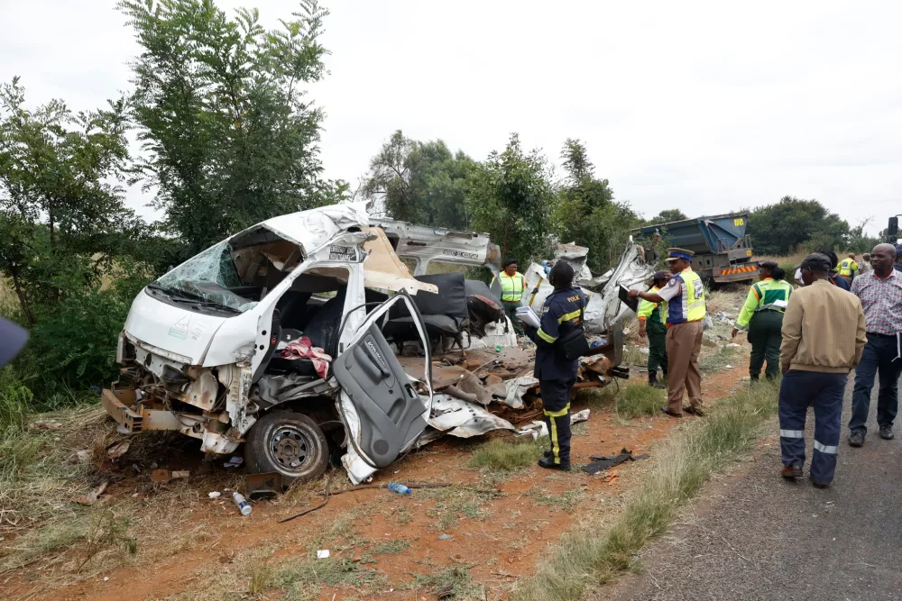 Police inspects the scene of a collision between a truck and a minibus carrying school children in Vanderbijlpark, South of Johannesburg, South Africa, Monday, Jan. 19, 2026. (AP Photo)