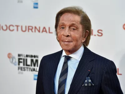 FILE PHOTO: Designer Valentino Garavani poses as he arrives for the gala screening of the film "Nocturnal Animals" during the 60th British Film Institute (BFI) London Film Festival at Leicester Square in London, Britain October 14, 2016. REUTERS/Hannah McKay/File Photo