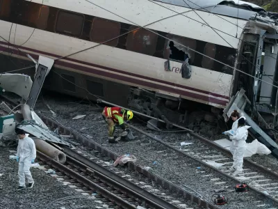 Members of the Spanish Civil Guard crime department work next to the trains&nbsp;involved in the accident, at the site of a deadly derailment of two high-speed trains near Adamuz, in Cordoba, Spain, January 19, 2026. REUTERS/Susana Vera   TPX IMAGES OF THE DAY