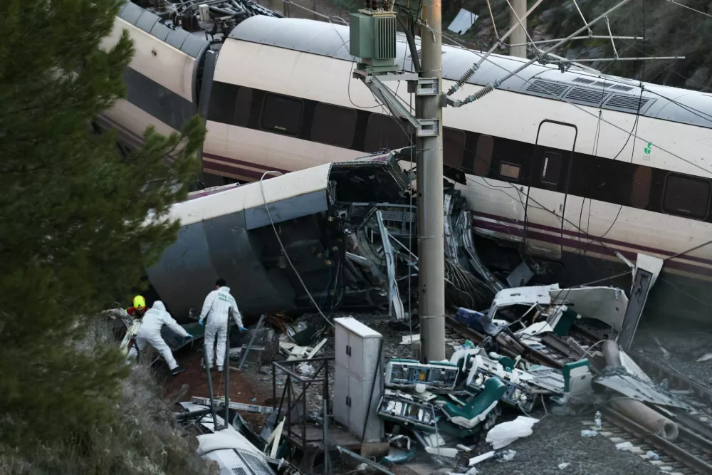 Members of the Spanish Civil Guard crime department work next to the trains&nbsp;involved in the accident, at the site of a deadly derailment of two high-speed trains near Adamuz, in Cordoba, Spain, January 19, 2026. REUTERS/Susana Vera
