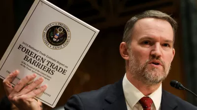 U.S. Trade Representative Jamieson Greer holds a copy of "Foreign Trade Barriers" as he testifies before a Senate Finance Committee hearing on U.S. President Donald Trump's trade policy, on Capitol Hill in Washington, D.C., U.S., April 8, 2025. REUTERS/Kevin Mohatt