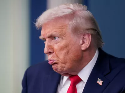 U.S. President Donald Trump reacts during a press briefing at the White House, on the one-year mark into his second term in office, in Washington, D.C., U.S., January 20, 2026. REUTERS/Nathan Howard