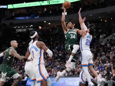 Milwaukee Bucks' Giannis Antetokounmpo shoots past Oklahoma City Thunder's Ajay Mitchell during the second half of an NBA basketball game Wednesday, Jan. 21, 2026, in Milwaukee. (AP Photo/Morry Gash)