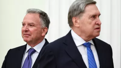U.S. President Donald Trump's envoy Steve Witkoff, left, and Kremlin foreign policy adviser Yuri Ushakov, wait for their meeting with Russian President Vladimir Putin at the Senate Palace of the Kremlin, in Moscow, Thursday, Jan. 22, 2026. (Alexander Kazakov/Sputnik, Kremlin Pool Photo via AP)