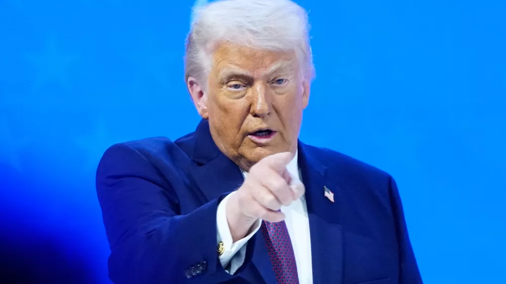 President Donald Trump reacts during a signing ceremony on his Board of Peace initiative at the Annual Meeting of the World Economic Forum in Davos, Switzerland, Thursday, Jan. 22, 2026. (AP Photo/Markus Schreiber)