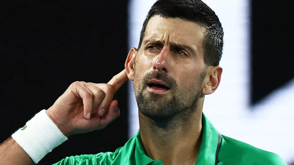 Tennis - Australian Open - Melbourne Park, Melbourne, Australia - January 24, 2026 Serbia's Novak Djokovic celebrates and gestures to crowd after winning his third round match against Netherlands' Botic van de Zandschulp REUTERS/Tingshu Wang   TPX IMAGES OF THE DAY