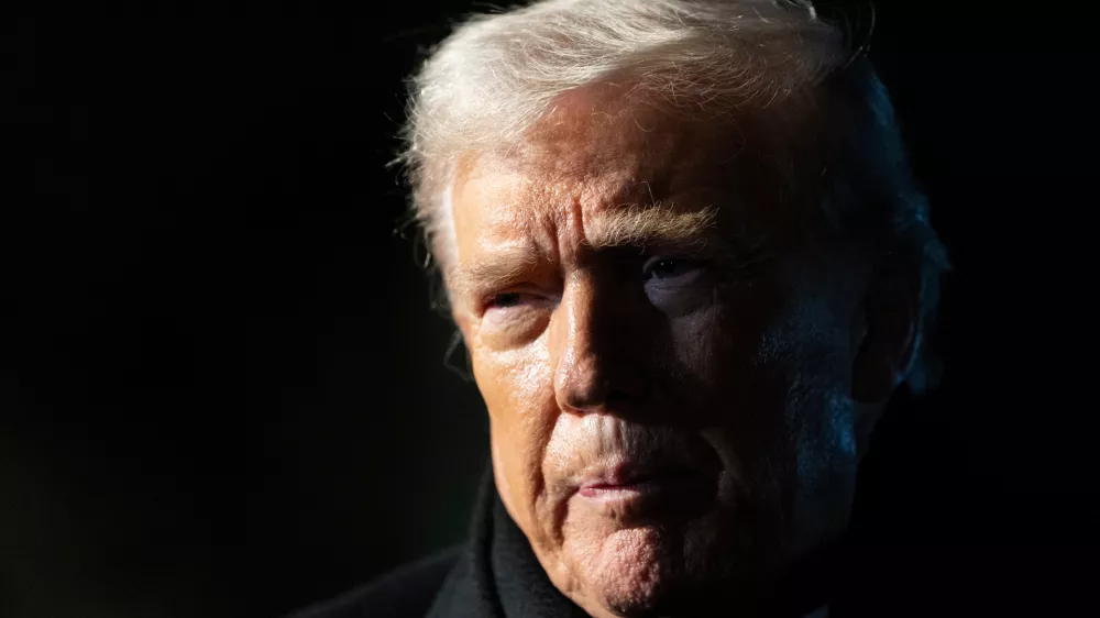 FILE - President Donald Trump speaks before departing on Marine One from the South Lawn of the White House, Jan. 20, 2026, in Washington. (AP Photo/Alex Brandon, File)