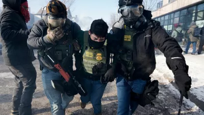 Federal agents carry away a colleague during scuffles at the scene of a shooting involving federal immigration agents in Minneapolis, Minnesota, U.S., January 24, 2026. REUTERS/Tim Evans    TPX IMAGES OF THE DAY