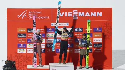Ski Jumping - Ski Flying World Championships - Heini-Klopfer Ski Flying Hill, Oberstdorf, Germany - January 24, 2026 Slovenia's Domen Prevc celebrates on the podium after winning the men's individual HS235 with second placed Norway's Marius Lindvik and third placed Japan's Ren Nikaido REUTERS/Kai Pfaffenbach