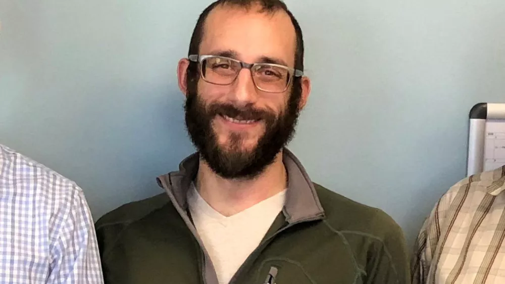 An undated handout image of Alex Pretti, who was fatally shot by U.S. immigration agents as they tried to detain him in Minneapolis, Minnesota, U.S., obtained by Reuters on January 25, 2026. U.S. Department of Veterans Affairs/Handout via REUTERS  THIS IMAGE HAS BEEN SUPPLIED BY A THIRD PARTY. MANDATORY CREDIT. EDITORS PLEASE NOTE: THIS IMAGE HAS BEEN CROPPED BY REUTERS FROM THE ORIGINAL PHOTOGRAPH AS TO NOT IDENTIFY THE OTHER PEOPLE IN THE PHOTOGRAPH.