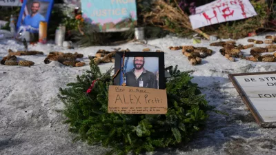 A makeshift memorial is placed where Alex Pretti was fatally shot by a U.S. Border Patrol officer yesterday, in Minneapolis, Sunday, Jan. 25, 2026. (AP Photo/Adam Gray)