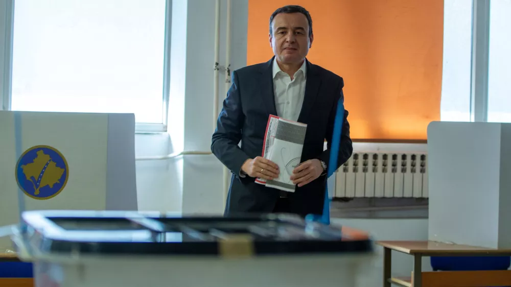 Kosovo's acting prime minister and leader of VeteVendosje political party Albin Kurti holds his ballot in Kosovo's capital Pristina, Sunday Dec. 28, 2025. (AP Photo/Visar Kryeziu)
