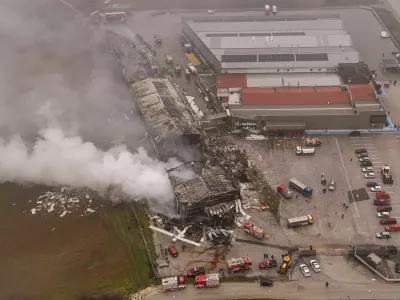 A drone view of emergency personnel working at the site of a biscuit factory, following a fire which left victims and missing people, the fire brigade said, near Trikala, Greece, January 26, 2026. REUTERS/Stringer