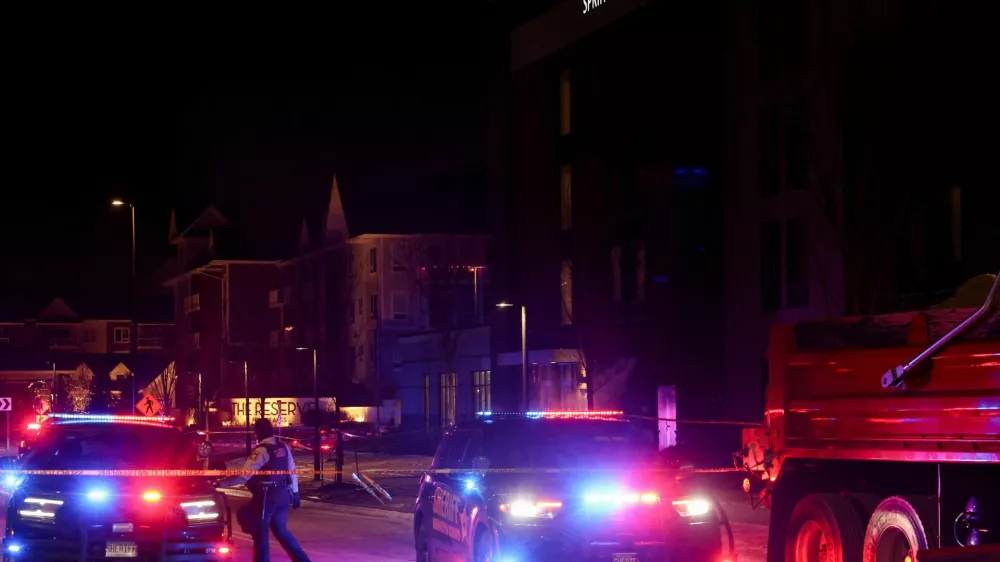 Police vehicles block a road near a hotel where Greg Bovino, who has been removed from his role as the "commander at large" for the U.S. Border Patrol, is reportedly staying, in Minneapolis, Minnesota, U.S., January 26, 2026. REUTERS/Shannon Stapleton