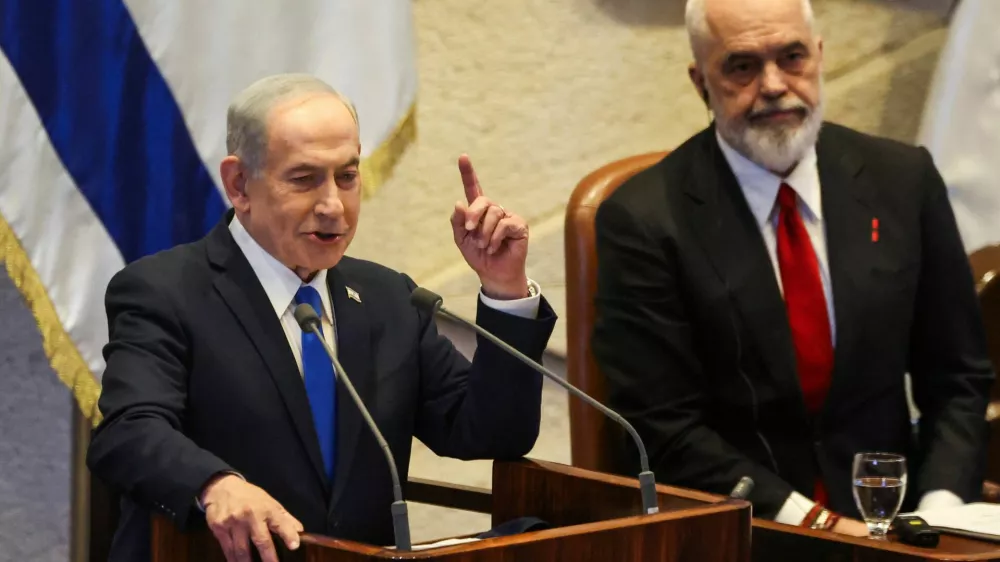 Israeli Prime Minister Benjamin Netanyahu speaks at the plenum of the Knesset, next to Albania's Prime Minister Edi Rama, in Jerusalem, January 26, 2026. REUTERS/Ronen Zvulun