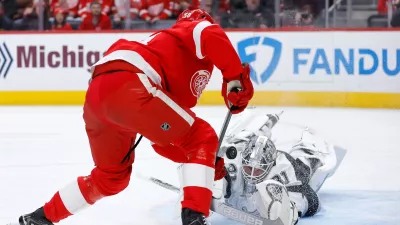 Los Angeles Kings goaltender Anton Forsberg deflects a shot on goal against Detroit Red Wings center Emmitt Finnie during the first period of an NHL hockey game, Tuesday, Jan. 27, 2026, in Detroit. (AP Photo/Duane Burleson)