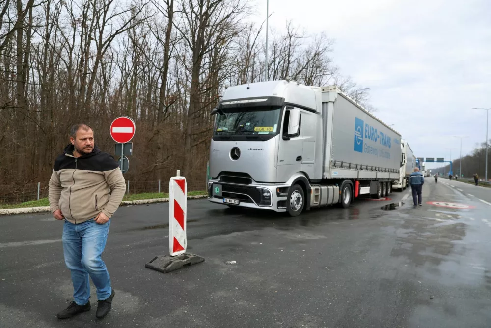A truck driver looks on during a protest by truck drivers and transport union representatives at the Serbia-Croatia border crossings, citing disruptions linked to the European Union's new Entry-Exit System (EES), in Batrovci, Serbia, January 26, 2026. REUTERS/Zorana Jevtic