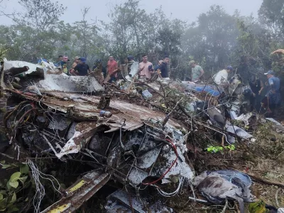 People stand near the wreckage of a plane crash in Playa de Belen, North Santander Colombia, January 28, 2026, in this picture obtained from social media. Notiplaya/via REUTERS THIS IMAGE HAS BEEN SUPPLIED BY A THIRD PARTY. MANDATORY CREDIT Verification lines:The location of the footage was confirmed from the source and authorities report of the plane crash. Reuters was also able to confirm the airline logo, colors and pattern of debris from wreckage that matched the SEARCA plane from file images. The date of footage was verified from original file metadata. FlightRadar24.com showed the flight taking off from Camilo Daza International Airport at around 16:40UTC and flew towards Ocana before disappearing on the radar at around 16:54UTC.