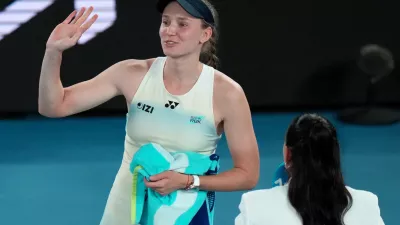 Elena Rybakina of Kazakhstan waves after winning her semifinal match against Jessica Pegula of the U.S. at the Australian Open tennis championship in Melbourne, Australia, Thursday, Jan. 29, 2026. (AP Photo/Dar Yasin)