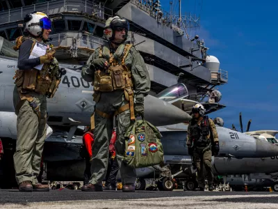 This handout image from the U.S. Navy shows Capt. Daniel Keeler, the commanding officer of the Nimitz-class aircraft carrier USS Abraham Lincoln, as he prepares to fly an MH-60R Sea Hawk helicopter in the Indian Ocean on Jan. 23, 2026. (Mass Communication Specialist Seaman Daniel Kimmelman/U.S. Navy via AP)
