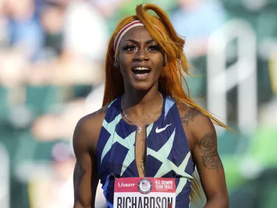 In this June 19, 2021 photo, Sha'Carri Richardson celebrates after winning the first heat of the semis finals in women's 100-meter runat the U.S. Olympic Track and Field Trials in Eugene, Ore.  Richardson cannot run in the Olympic 100-meter race after testing positive for a chemical found in marijuana. Richardson, who won the 100 at Olympic trials in 10.86 seconds on June 19, told of her ban Friday, July 2 on the "Today Show."(AP Photo/Ashley Landis)