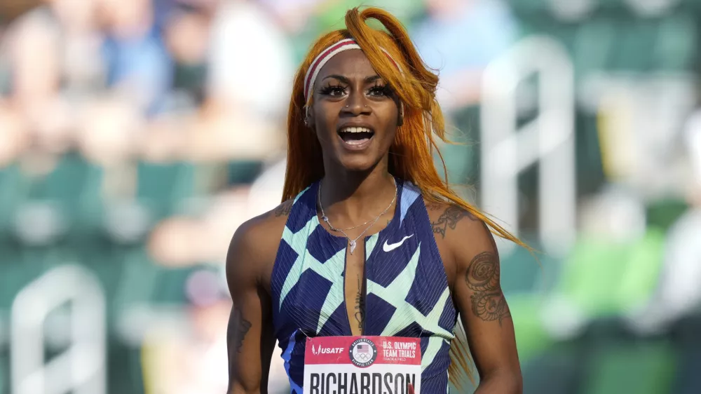 In this June 19, 2021 photo, Sha'Carri Richardson celebrates after winning the first heat of the semis finals in women's 100-meter runat the U.S. Olympic Track and Field Trials in Eugene, Ore.  Richardson cannot run in the Olympic 100-meter race after testing positive for a chemical found in marijuana. Richardson, who won the 100 at Olympic trials in 10.86 seconds on June 19, told of her ban Friday, July 2 on the "Today Show."(AP Photo/Ashley Landis)