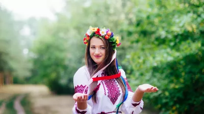 Portrait of a girl in nationac ukrainian clothes in the park