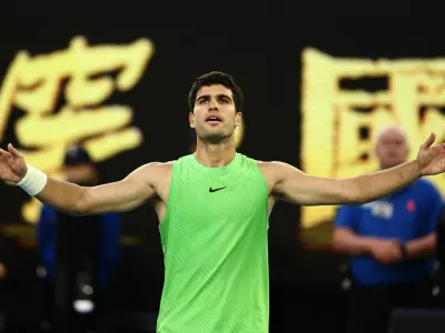 Tennis - Australian Open - Melbourne Park, Melbourne, Australia - January 30, 2026 Spain's Carlos Alcaraz celebrates after winning his semi final match against Germany's Alexander Zverev REUTERS/Tingshu Wang