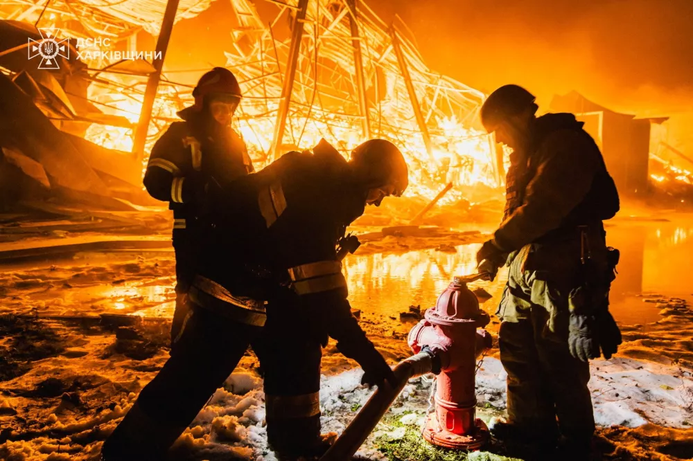 Firefighters work at the site of a private enterprise hit by an overnight Russian missile strike, amid Russia's attack on Ukraine, in Kharkiv, Ukraine, January 30, 2026. Press service of the State Emergency Service of Ukraine in Kharkiv region/Handout via REUTERS ATTENTION EDITORS - THIS IMAGE HAS BEEN SUPPLIED BY A THIRD PARTY. DO NOT OBSCURE LOGO.